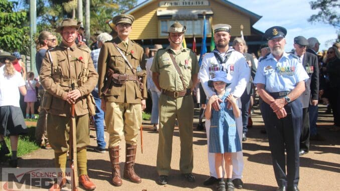 Reenactors with serving personnel