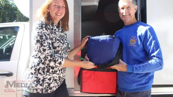 Tamborine Mountain volunteer Jodi Meynell with Beaudesert Meals on Wheels delivery driver Mick Watt